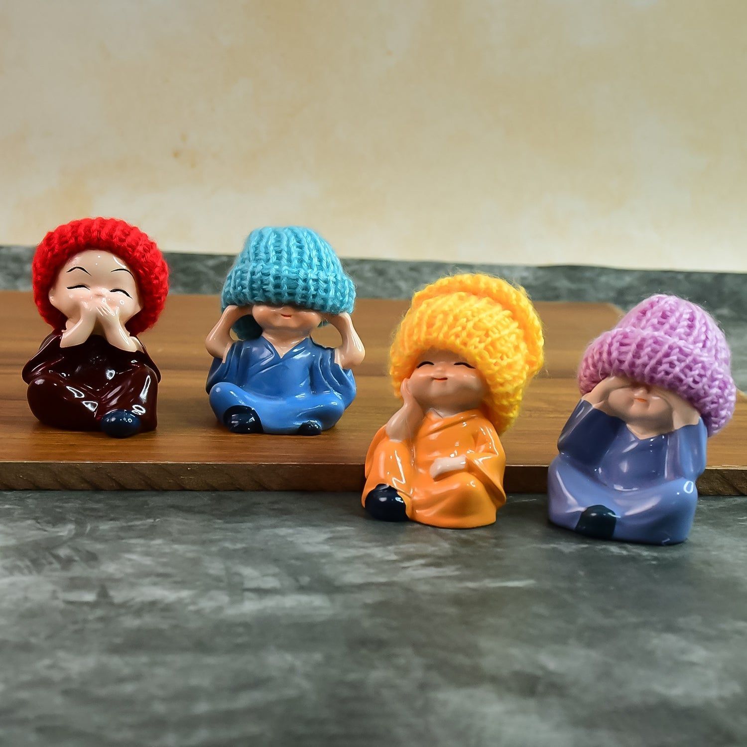Decorative Resin Monk Buddha Showpiece Set of 4 with Traditional Straw Hats